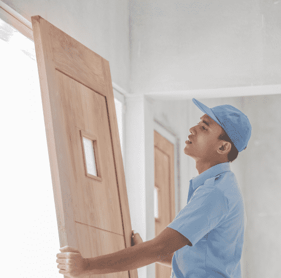 worker doing door installation